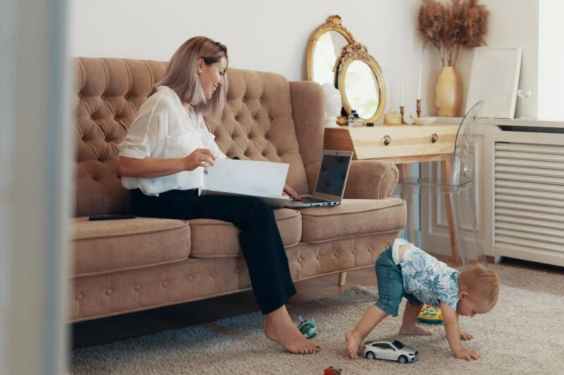 beautiful-business-woman-working-home-multi-tasking-freelance-motherhood-concept